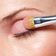 Using the Eyeshadow Blender & Applicator Brush apply Pink Crystal from the VIP Beauty Collection all over eyelids
